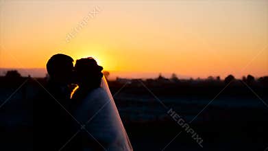 Close-up of a charming couple, speaking, kissing