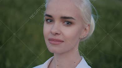 Portrait of Young Beautiful Blonde Woman In The City Sunset