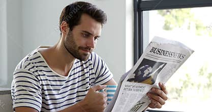 Man is reading newspaper