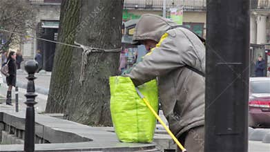Homeless man looking in the bag