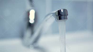Silver faucet water drips dripping