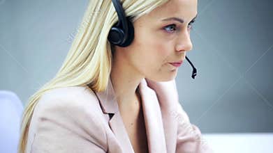 Businesswoman with headset talking at office