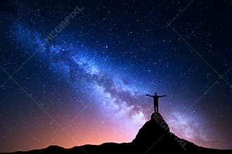 Silhouette of a standing man on the mountain peak