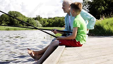 Grandfather and grandson fishing on river berth 13