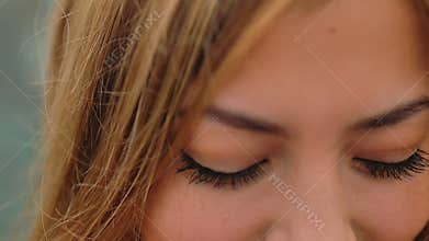 Girl blonde look flirting big eyes slow motion