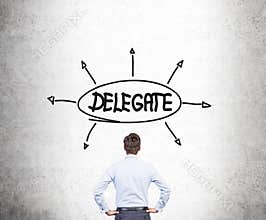 Businessman looking at delegate sketch