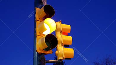 City traffic light turns from green to red
