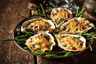 Oysters with Cheesy Gratin Topping Served on Plate