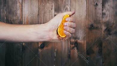 Squeeze the Juice from the Orange by Hand. Slow Motion