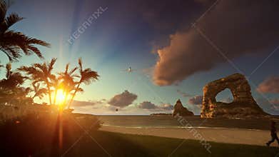 Little boy with airplane toy and aircraft landing, tropical beach, tilt