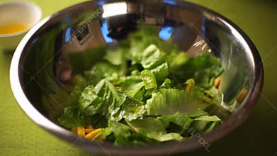 Dressing salad of Romaine lettuce, olive oil and soy sauce.