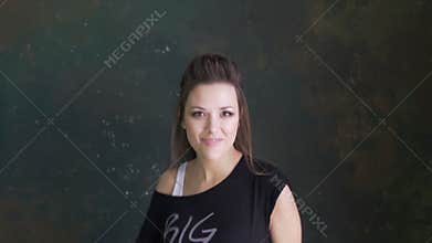 A beautiful young girl dancing to the music.