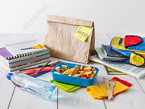 Healthy school lunch in box on white wood table background