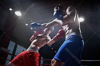 Fighting in boxing ring