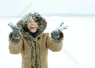 Woman throwing snow