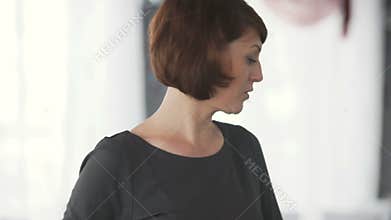 Woman talking to audience.