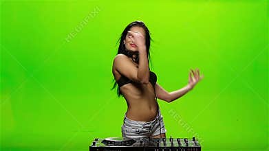 Girl DJ makes erotic movements with his hands. Green screen. Slow motion