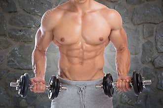 Bodybuilder bodybuilding muscles dumbbells biceps training power
