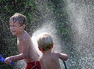 Brothers Playing with Water