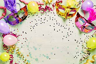 Colorful carnival masks and party balloons