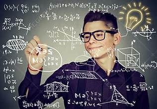 Guy writing high school maths and science formulas