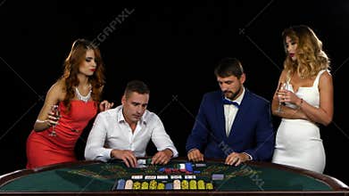 Gamble at the poker table. Girls give advice to men