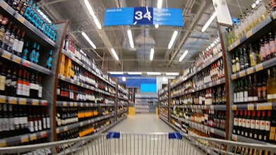 St.-Petersburg, Russia â€“ LENTA, January, 2017: shelves in a supermarket with a white and red wine.