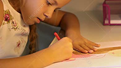 Girl coloring a drawing