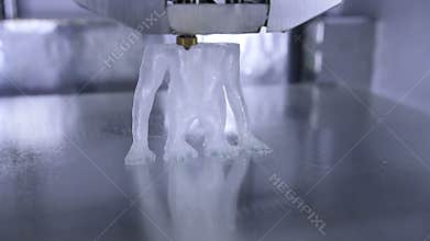 Timelapse of 3D printer print the human like monkey using plastic filament