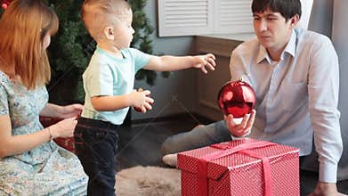 Happy Family Decorating Christmas Tree