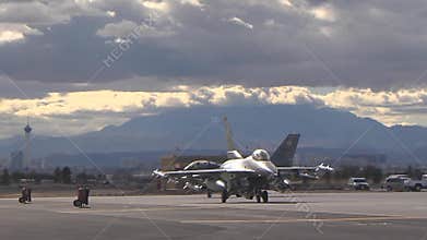 Taxing out to the runway two f-16 fighting falcon at red flag