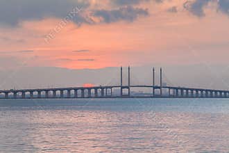 Sunrise by the shore with view of Penang Bridge