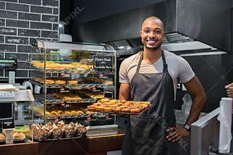 Pastry chef holding small pastry