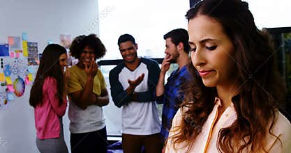 Colleagues bullying a sad female executive