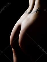 Nude woman buttocks