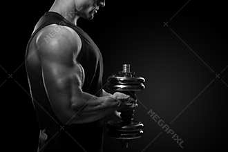 Close-up of a power fitness man Handsome power athletic man in t
