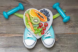 Healthy lifestyle concept with diet and fitness abstract on wooden boards