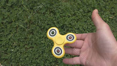 Fidget spinner turns on the finger.