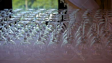 Empty glasses for wine and water set on a festive table in a restaurant focus shift of glassware