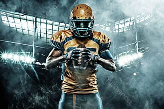 American football sportsman player on stadium with lights on background