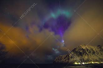 Amazing multicolored Aurora Borealis also know as Northern Lights in the night sky over Lofoten landscape, Norway, Scandinavia.