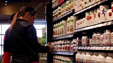 Woman asking worker about health food question