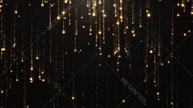 Falling gold particles flicker and shimmer against a black background. Abstract background for fashion glamor and wealth