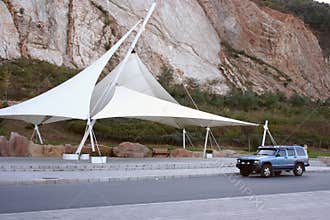 Awning and car