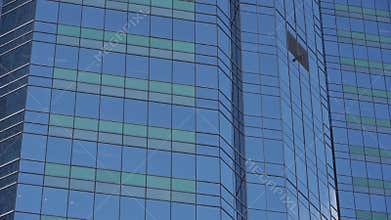 Closeup skyscraper glass windows,business buildings district,global commerce.