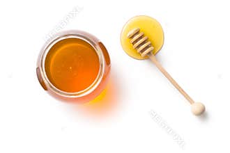 Honey dipper and honey in jar