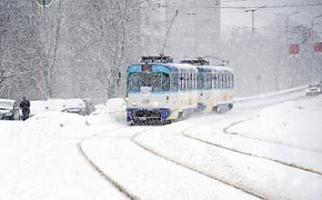 Winter. Movement of the tram during snowfall.