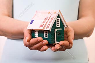 Home insurance concept with euro banknotes