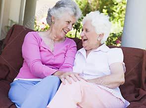 Senior female friends chatting together