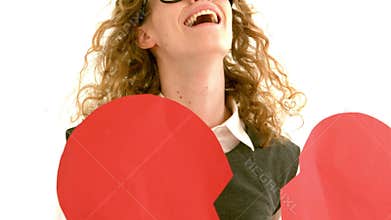 In slow motion geeky hipster holding a broken heart card